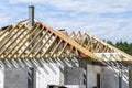 Roof trusses connected to the roof truss, not covered with a roof, with a steel I-beam instead of a corner rafter. Royalty Free Stock Photo