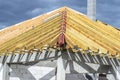 Roof trusses connected to the roof truss, not covered with a roof, with a steel I-beam instead of a corner rafter. Royalty Free Stock Photo