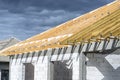 Roof trusses connected to the roof truss, not covered with a roof, with a steel I-beam instead of a corner rafter. Royalty Free Stock Photo