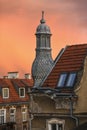 Roof turret of a townhouse during sunset.