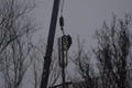 Workers climb into the transmission tower to be removed