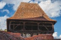 Roof of Viscri fortified church against the backdrop of a blue sky. Romania