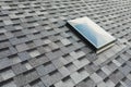 Roof window on shingles flat polymeric roof-tiles