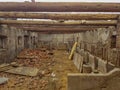 Roof of wooden beams on half destroyed barn Royalty Free Stock Photo