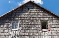 The roof of the wooden tile of the old rural house. Wood roof texture background.