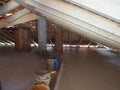 roof works with wooden beams and self levelling concrete floor