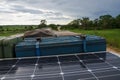 Roof of 4x4 offroad vehicle with jerry can, solar panel, roof top tent and storage box on dirt track in Angola, Africa Royalty Free Stock Photo