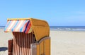 Roofed wicker beach chair. Egmond aan Zee, North Sea, the Netherlands. Royalty Free Stock Photo