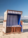 Roofed wicker beach chair