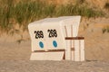 Roofed wicker beach chair on evening Royalty Free Stock Photo