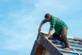 Roofer Attaching Shingles