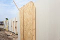 Roofer builder worker with crane installing structural Insulated Panels SIP. Building new frame energy-efficient house. Royalty Free Stock Photo