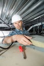 Roofer builder worker installing roof insulation material Royalty Free Stock Photo