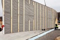 Roofer builder workers with crane installing structural Insulated Panels SIP. Building new frame energy-efficient house.