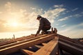 Roofer builder working on roof structure. Male worker contractor and wooden house frame on construction site.