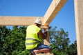 Roofer building house roof wooden trusses. Contractor with Hammer Roofing Construction. Roofer Construction.