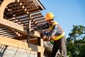 Roofer, A carpenter working on roof structure on construction site Royalty Free Stock Photo