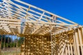 Roofer carpenters works on roof at height workers nailing wood beams on roof Royalty Free Stock Photo