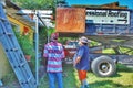 Roofer and contractor converse regarding the job