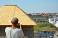 Roofer contractor installing house rooftop smoke stack chimney roof Royalty Free Stock Photo