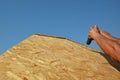 Roofer contractor installing house rooftop smoke stack chimney roof