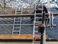 Roofer covers a new roof Royalty Free Stock Photo