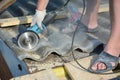 Roofer cut asbestos roof sheet with grinder Royalty Free Stock Photo