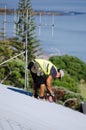 Roofer fixing a roof