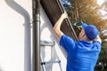 Roofer installing metal roof drip edge profile