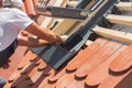 Roofer installs a skylight on the new roof. Royalty Free Stock Photo