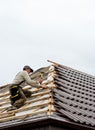 Roofer lying tiles Royalty Free Stock Photo