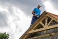 Roofer man roof carpenter working Country house renovation