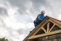 Roofer man roof carpenter working Country house renovation