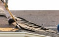 roofer removing roof shingles with roof shingle remover Royalty Free Stock Photo