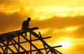 Roofer silhouette sunset