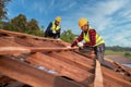 Roofer, Two roofer carpenter working on roof structure on construction site, Teamwork construction concept Royalty Free Stock Photo