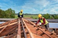 Roofer, Two worker roofer builder working on roof structure on construction site, Teamwork construction concept Royalty Free Stock Photo