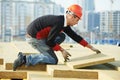 Roofer worker installing roof insulation material Royalty Free Stock Photo
