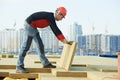 Roofer worker installing roof insulation material Royalty Free Stock Photo