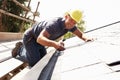 Roofer Working On Exterior