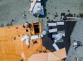 Roofer working on replacement asphalt shingle roof Royalty Free Stock Photo