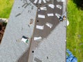 Roofer working on replacement asphalt shingle roof Royalty Free Stock Photo