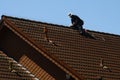 Roofer is working on a roof