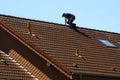 Roofer is working on a roof