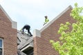 Roofers work on Campus 2019 III