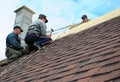 KIEV - UKRAINE, JANUARY - 11, 2017: Roofing Construction. Roofing Contractors Install New House Roofing with Asphalt Shingles