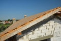 Roofing construction with trusses, wooden beams on new house building. Rooftop view Royalty Free Stock Photo
