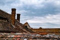 Roofing covered the house with old chimneys Royalty Free Stock Photo