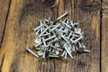 Roofing galvanized construction nails pile wood board background