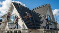 Roofing Installation: Construction Workers at Work Royalty Free Stock Photo